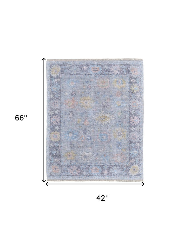 4' X 6' Orange Blue and Gold Floral Hand Woven Distressed Area Rug With Fringe