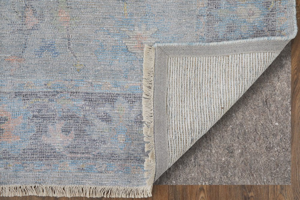 4' X 6' Orange Blue and Gold Floral Hand Woven Distressed Area Rug With Fringe