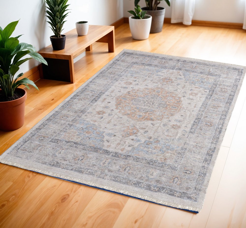 4' X 6' Ivory Blue and Orange Oriental Hand Woven Distressed Area Rug With Fringe