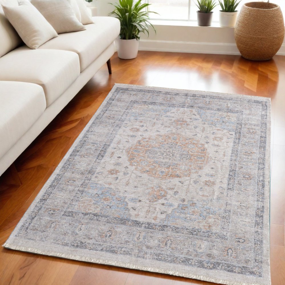 4' X 6' Ivory Blue and Orange Oriental Hand Woven Distressed Area Rug With Fringe