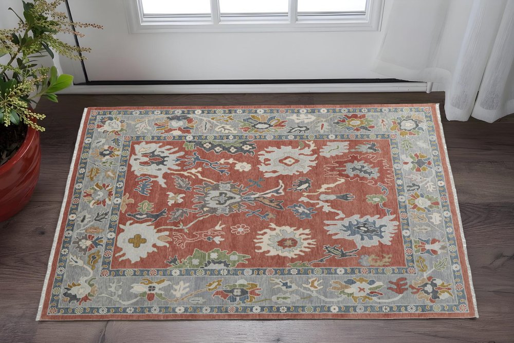 4' X 6' Gray Red and Ivory Wool Floral Hand Knotted Area Rug With Fringe