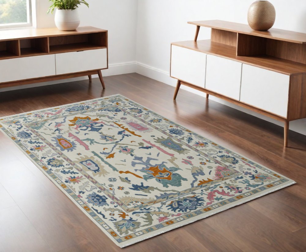 9' X 13' Blue Ivory and Pink Wool Floral Hand Knotted Area Rug With Fringe