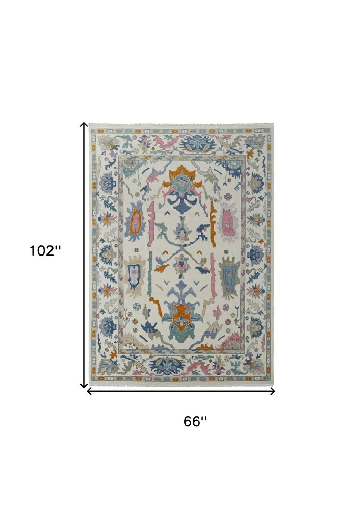 9' X 13' Blue Ivory and Pink Wool Floral Hand Knotted Area Rug With Fringe