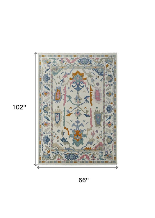 9' X 13' Blue Ivory and Pink Wool Floral Hand Knotted Area Rug With Fringe