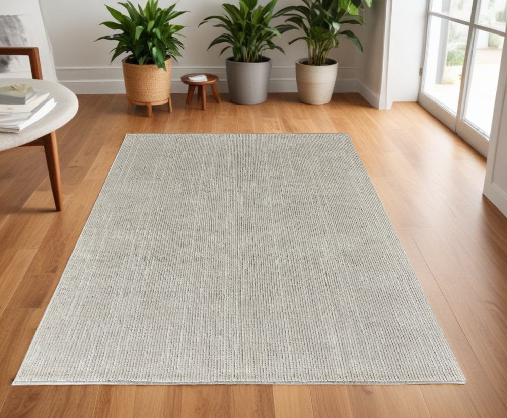 6' X 9' Tan and Ivory Wool Hand Knotted Area Rug