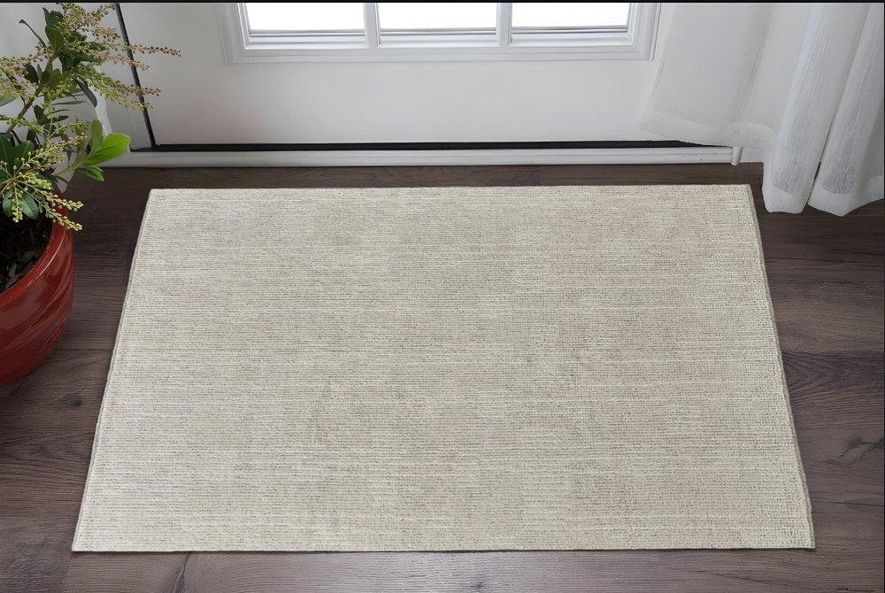 6' X 9' Tan and Ivory Wool Hand Knotted Area Rug