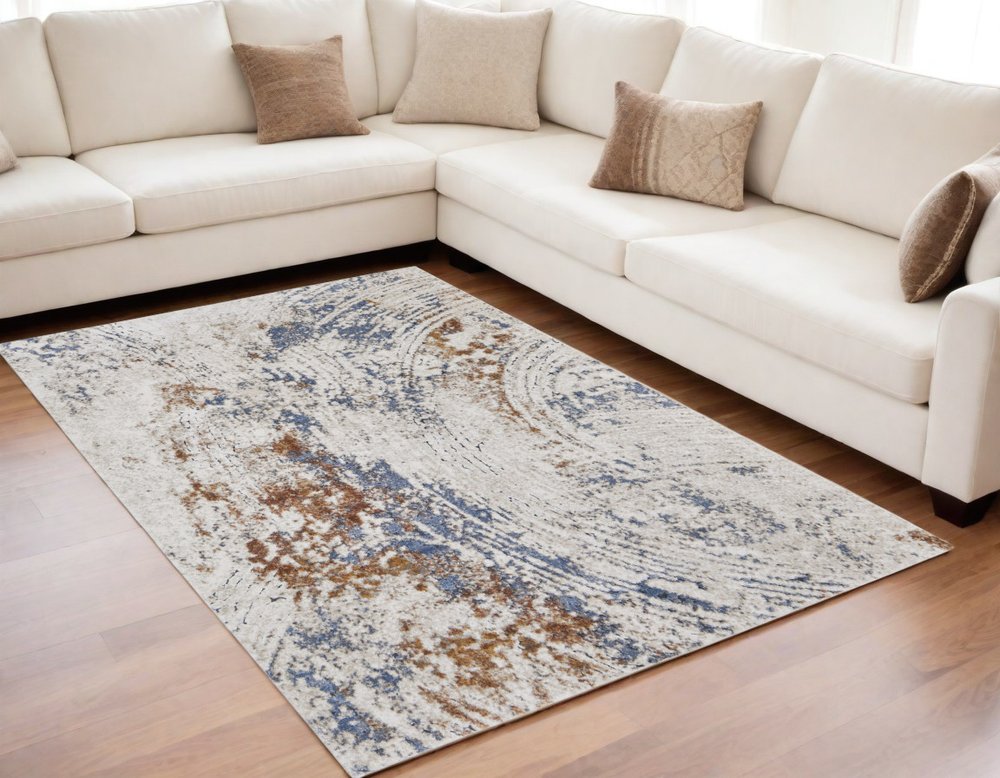 5' X 8' Ivory Blue and Brown Abstract Power Loom Area Rug