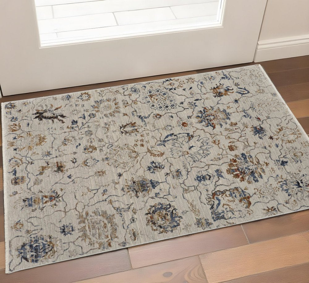 3' X 5' Ivory Blue And Burnt Orange Floral Distressed Area Rug With Fringe