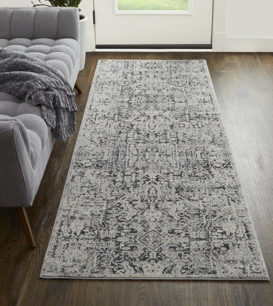3' X 5' Ivory and Gray Abstract Power Loom Worn Faded Area Rug With Fringe