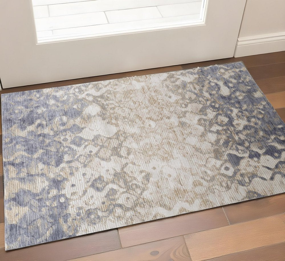 3' X 5' Ivory Tan And Blue Abstract Area Rug
