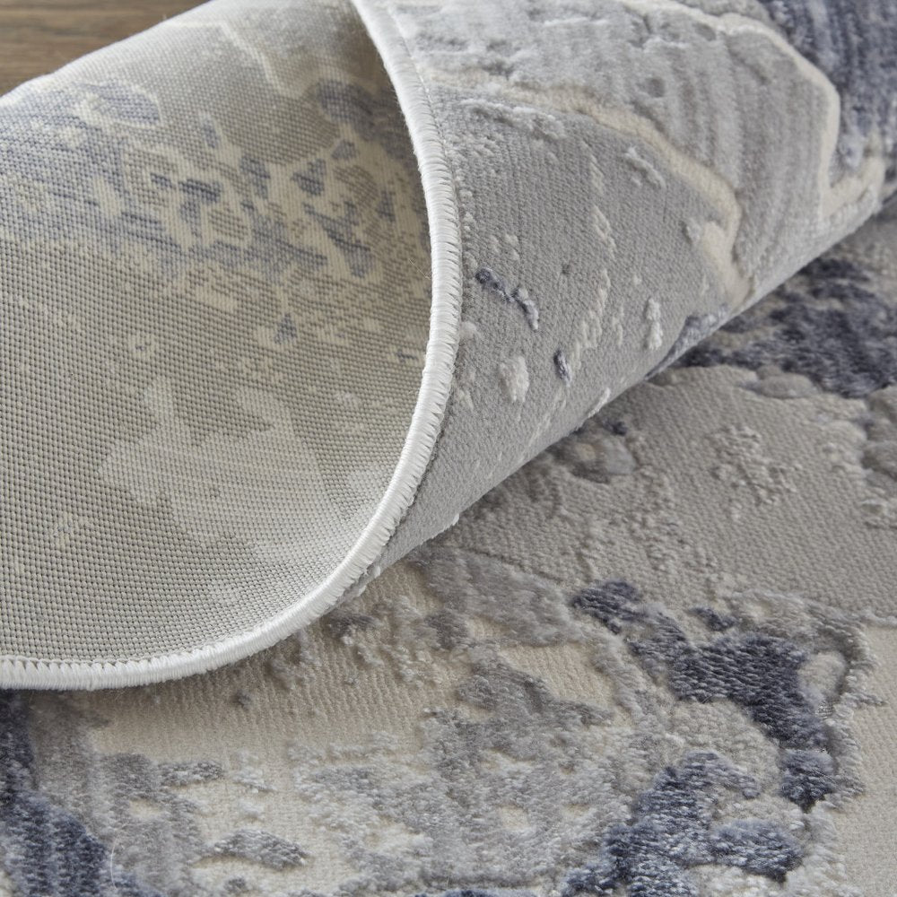 3' X 5' Ivory and Blue Abstract Power Loom Worn Faded Area Rug