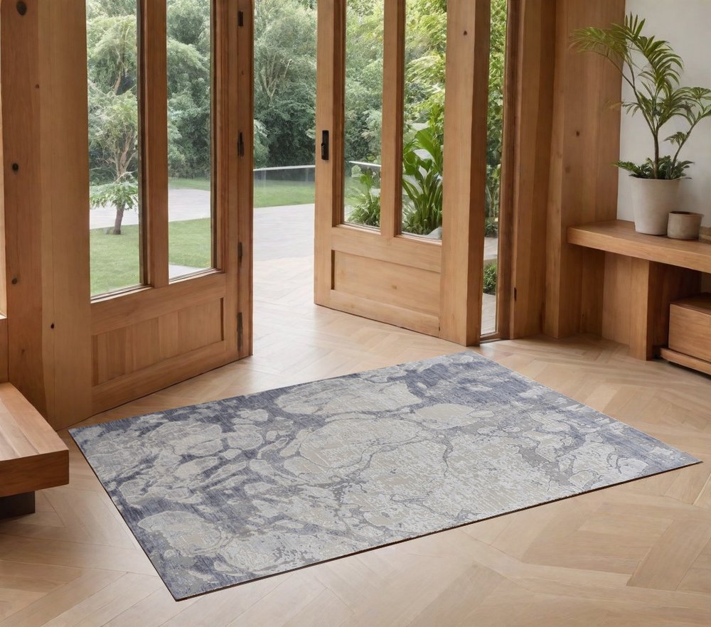 3' X 5' Ivory and Blue Abstract Power Loom Worn Faded Area Rug