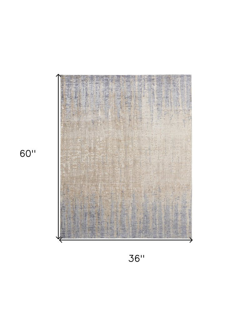 3' X 5' Tan And Blue Abstract Distressed Area Rug