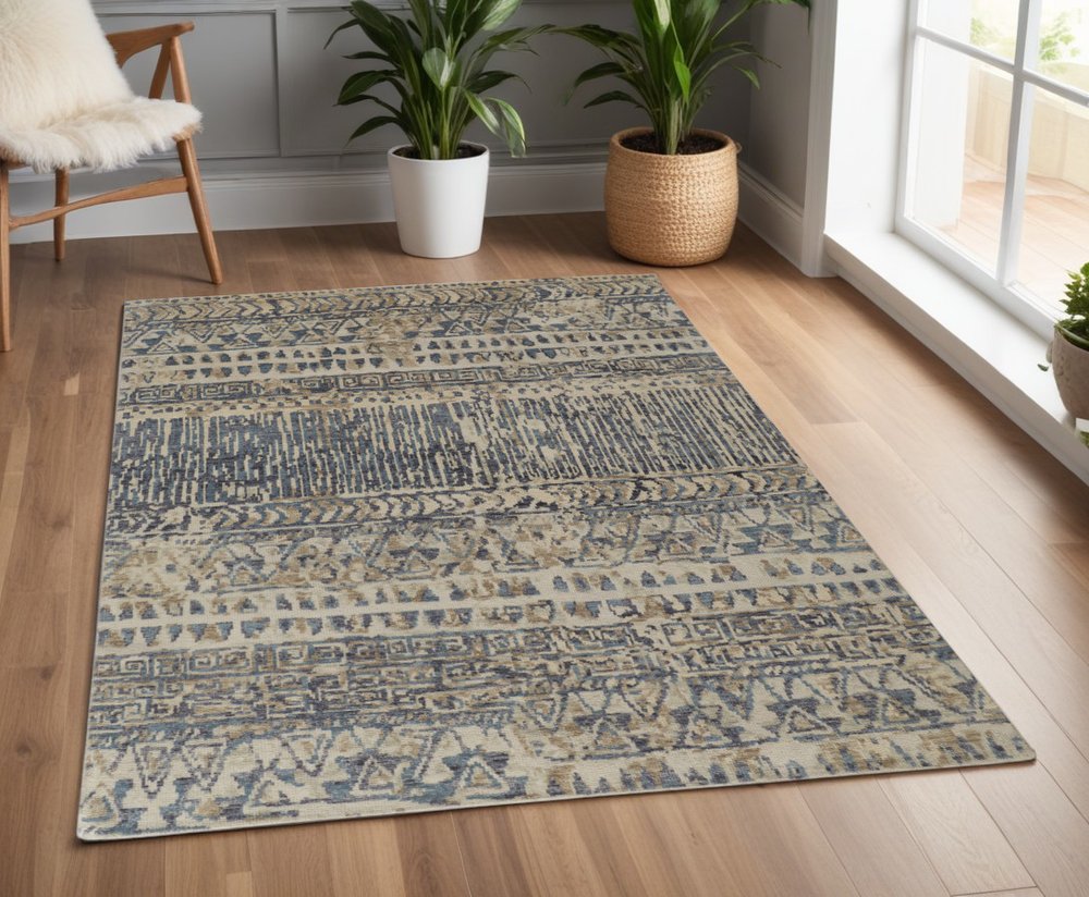 6' X 9' Tan Ivory And Blue Wool Geometric Hand Knotted Area Rug