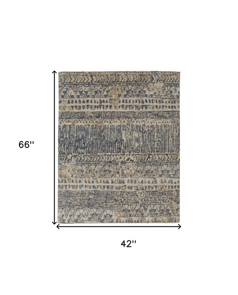 6' X 9' Tan Ivory And Blue Wool Geometric Hand Knotted Area Rug