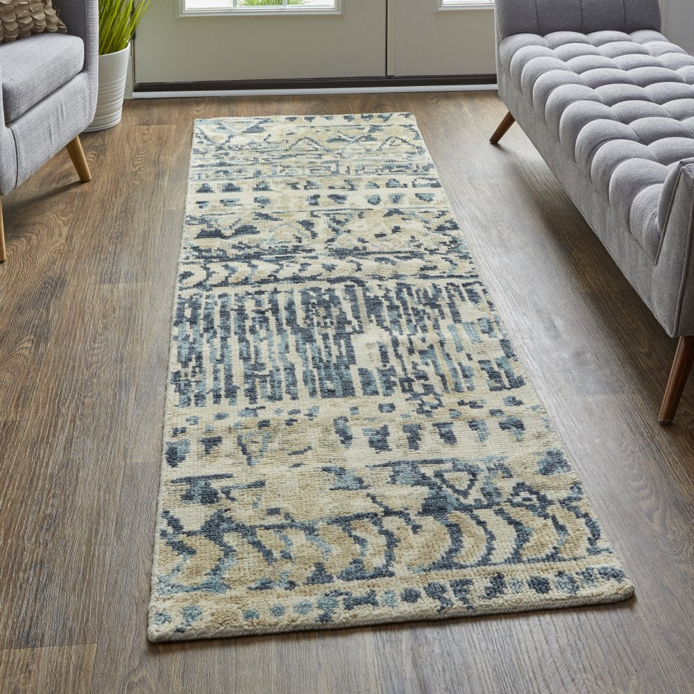 6' X 9' Tan Ivory And Blue Wool Geometric Hand Knotted Area Rug