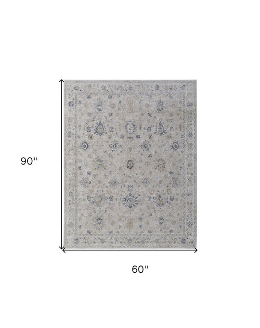 8' X 10' Ivory Taupe and Blue Floral Power Loom Worn Faded Area Rug With Fringe