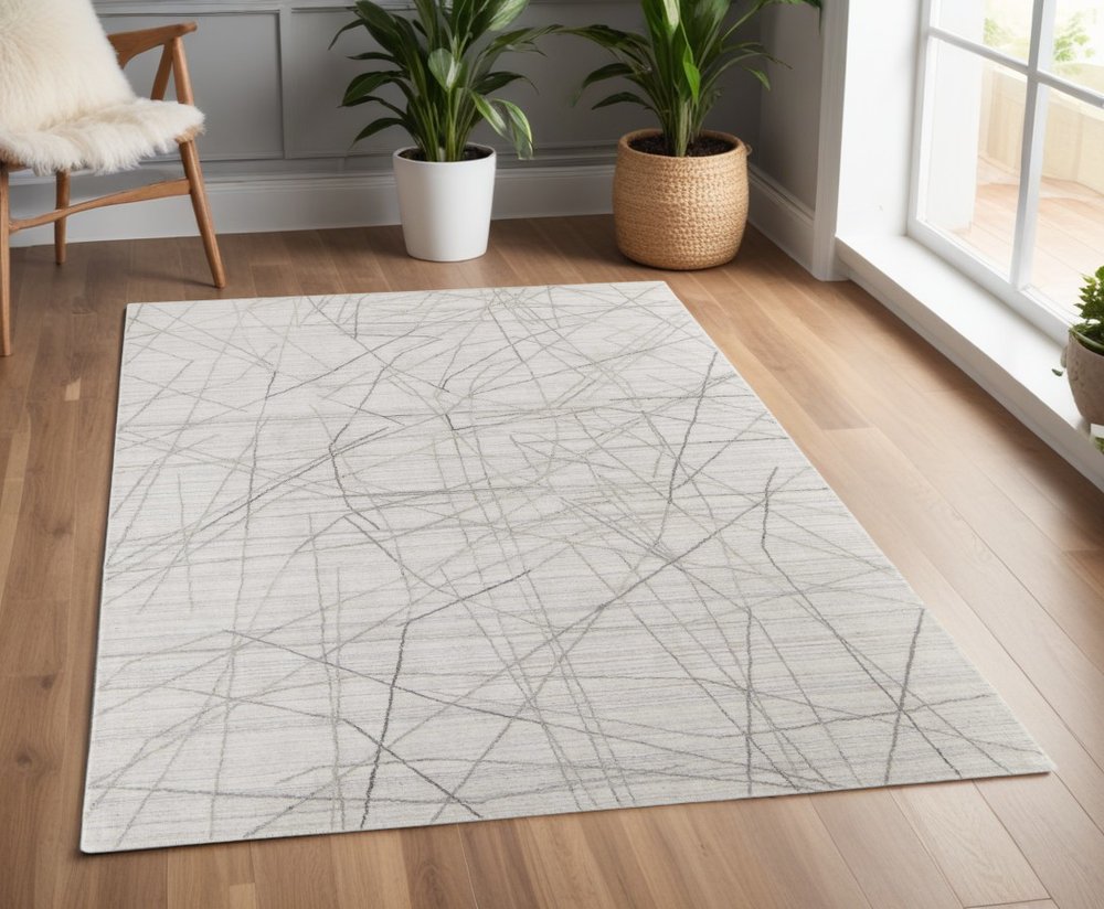 5' X 8' Gray and Ivory Abstract Hand Woven Area Rug