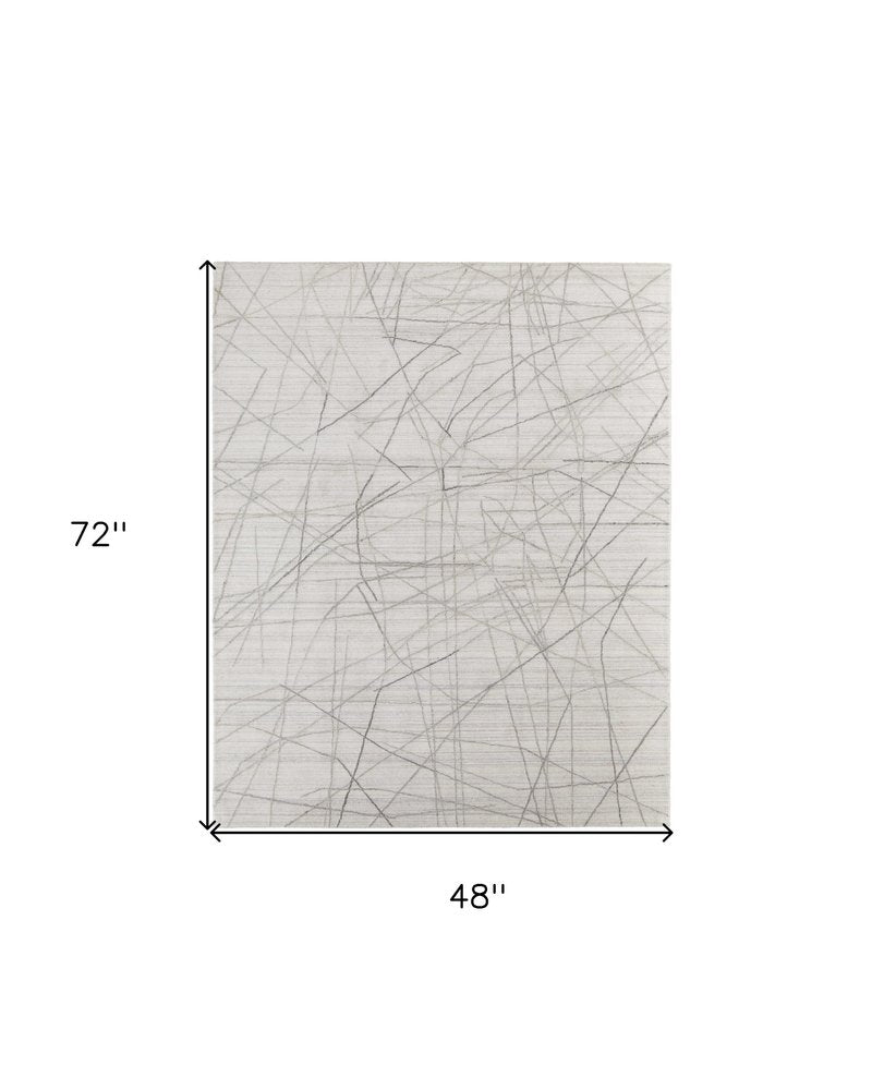 5' X 8' Gray and Ivory Abstract Hand Woven Area Rug