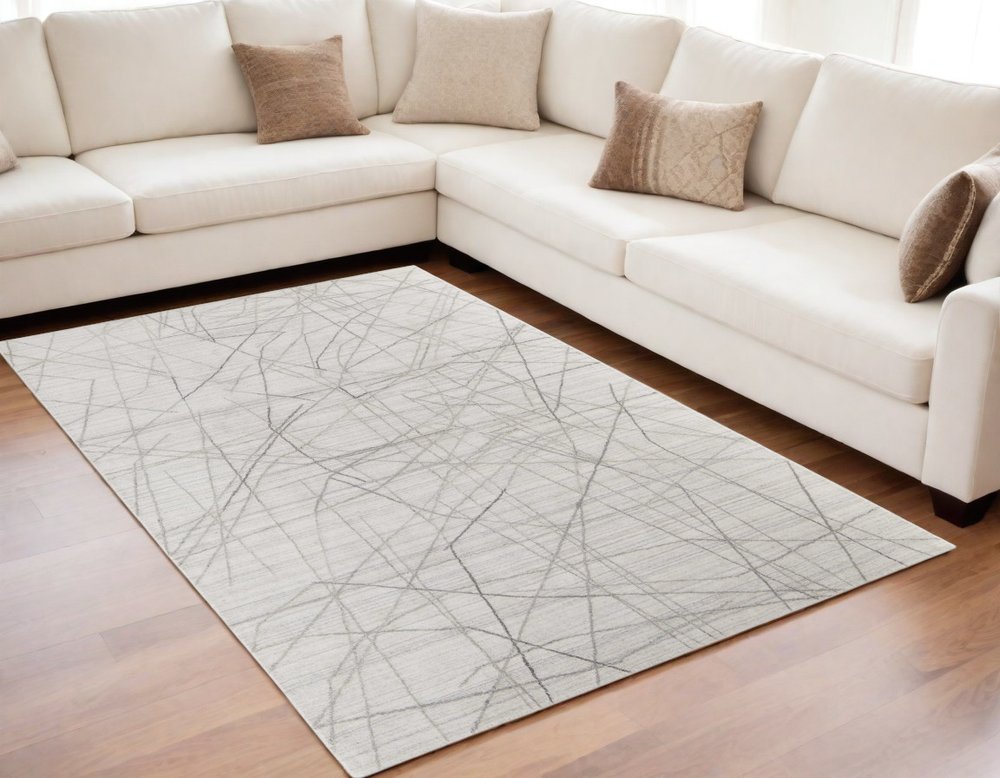 5' X 8' Gray and Ivory Abstract Hand Woven Area Rug