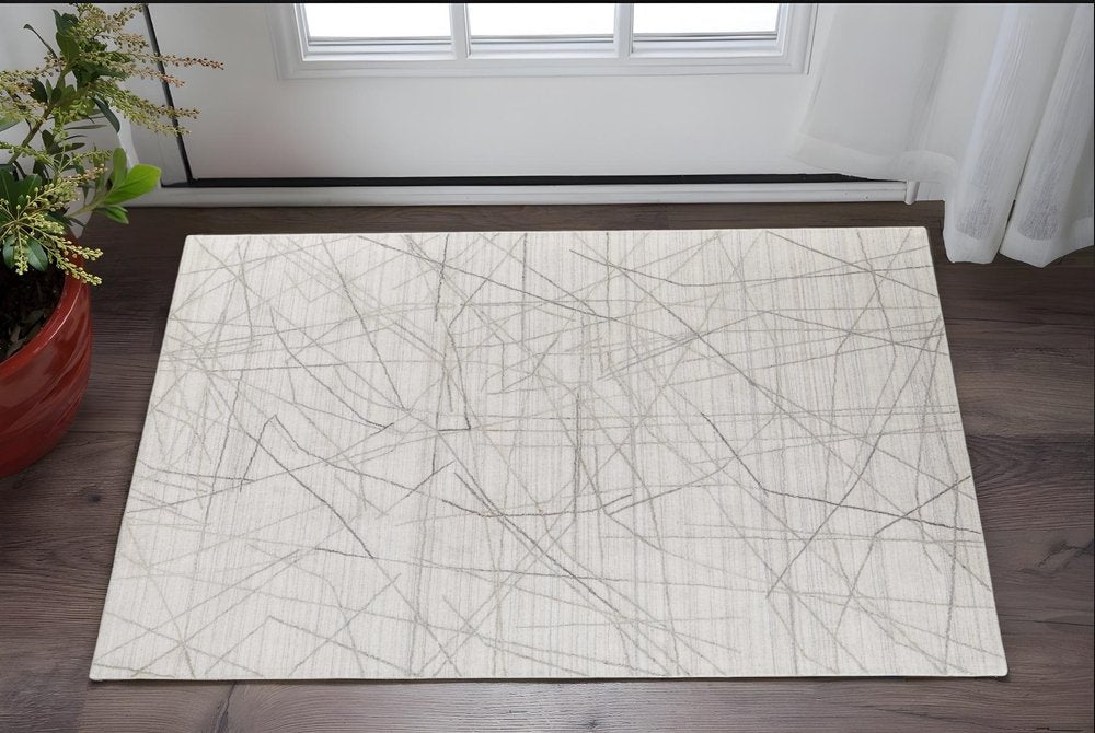 5' X 8' Gray and Ivory Abstract Hand Woven Area Rug