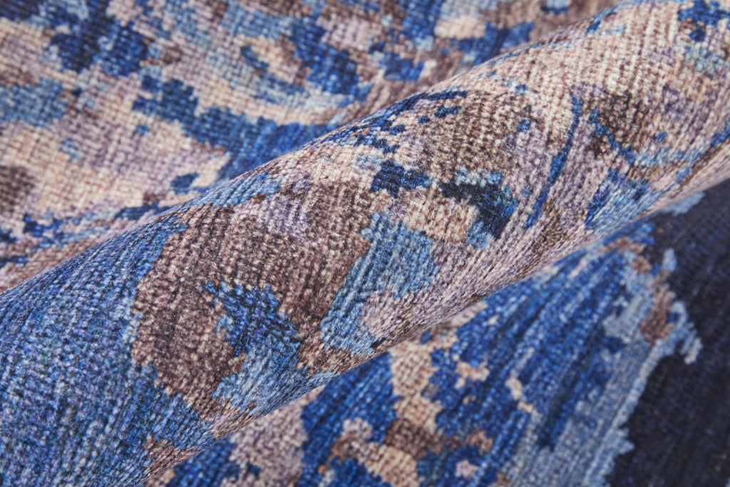 5' X 8' Blue Pink and Tan Abstract Power Loom Washable Area Rug