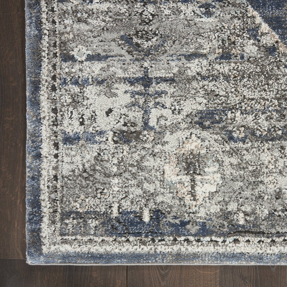 5' X 7' Blue Floral Power Loom Distressed Area Rug