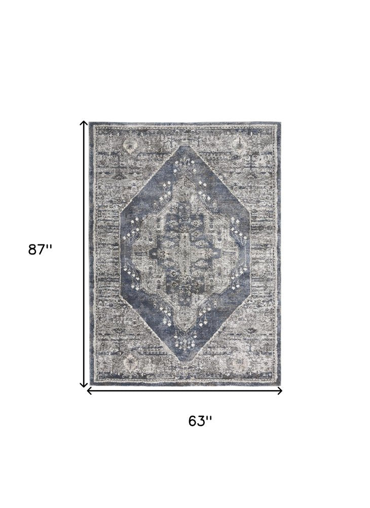 5' X 7' Blue Floral Power Loom Distressed Area Rug