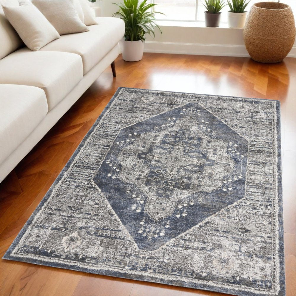 5' X 7' Blue Floral Power Loom Distressed Area Rug