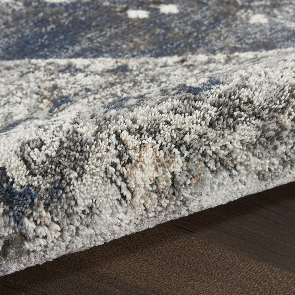 5' X 7' Blue Floral Power Loom Distressed Area Rug