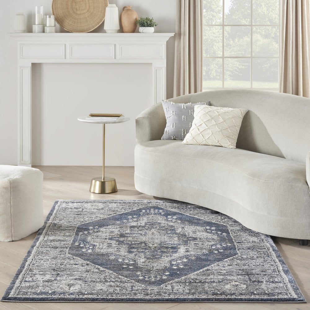 5' X 7' Blue Floral Power Loom Distressed Area Rug
