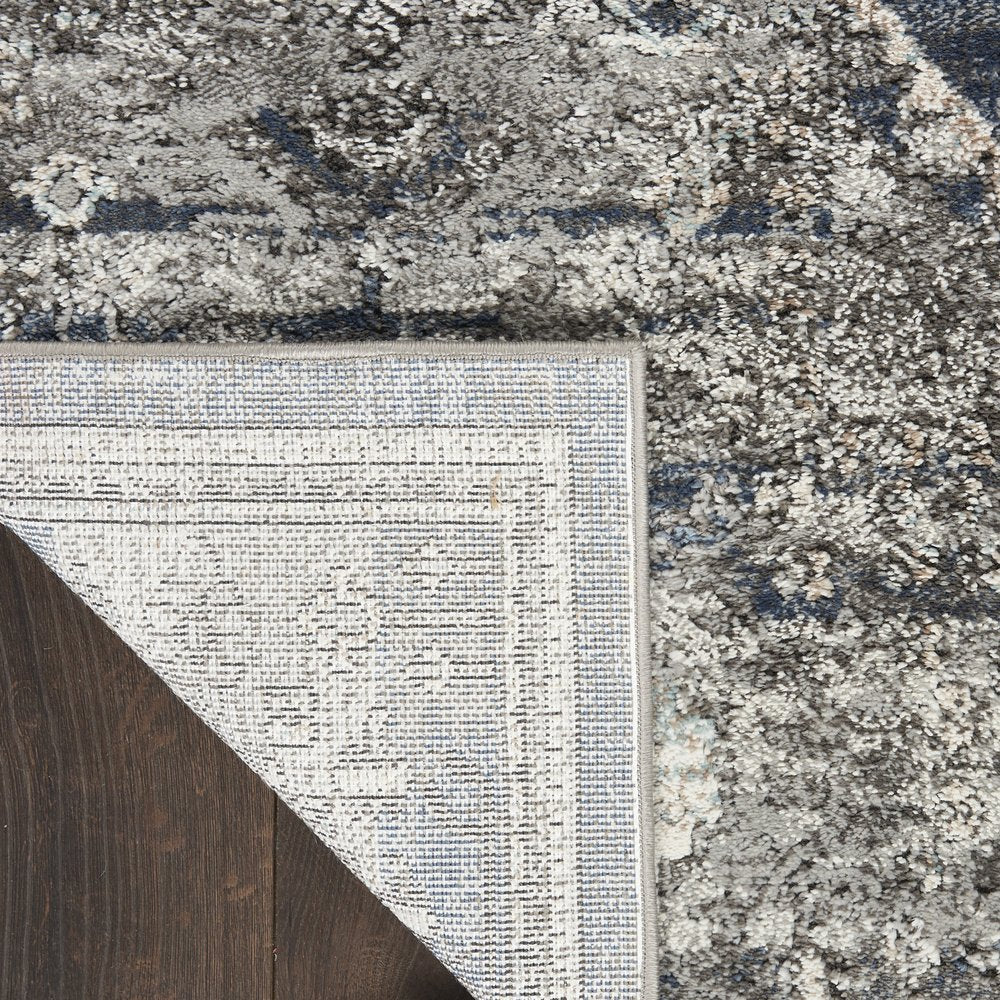 5' X 7' Blue Floral Power Loom Distressed Area Rug