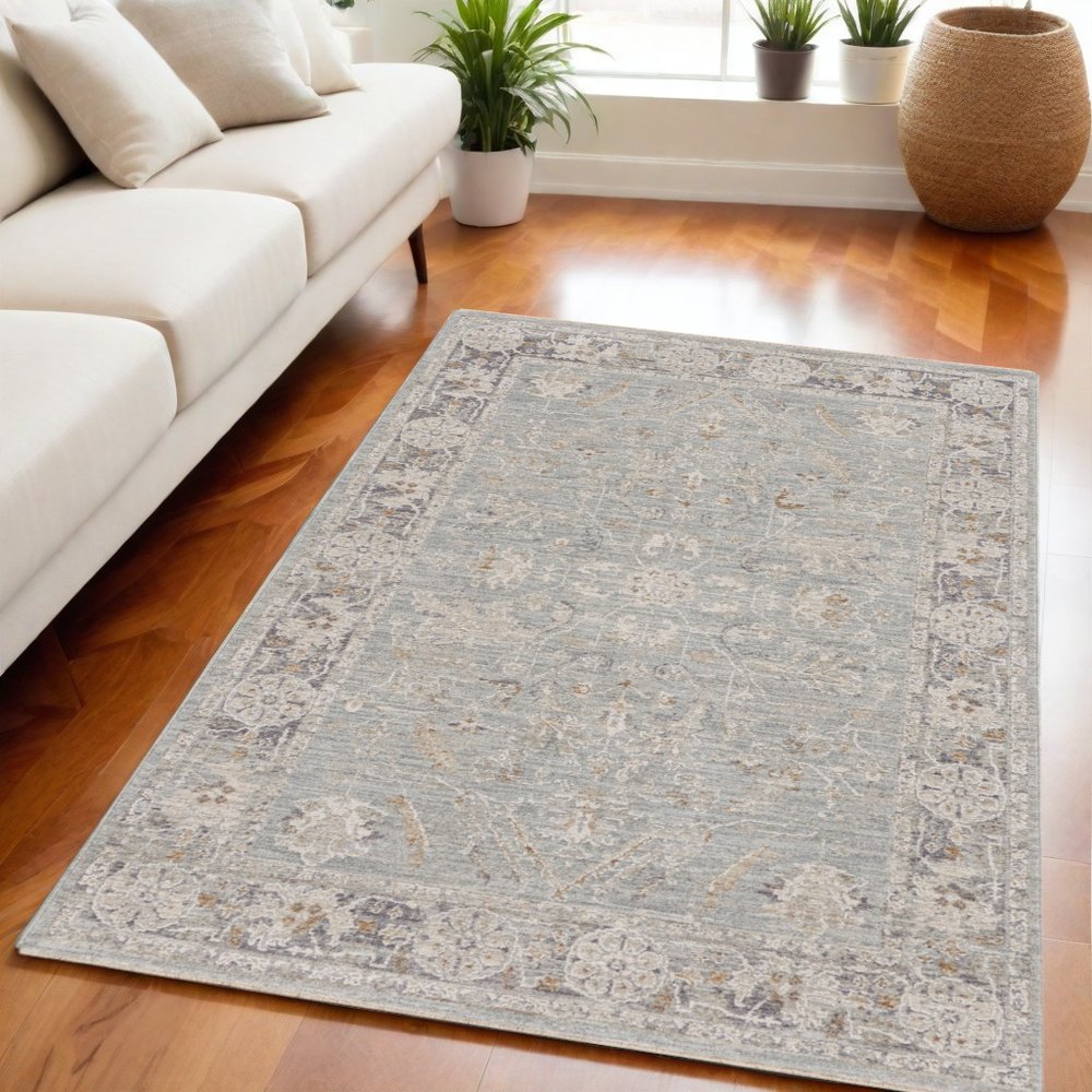 5' X 8' Blue Floral Power Loom Distressed Area Rug