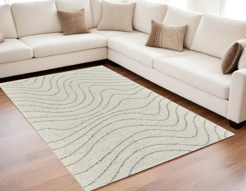 5' X 8' Cream and Beige Abstract Area Rug