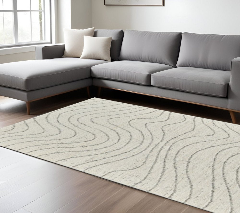 7' X 10' Cream and Beige Abstract Area Rug