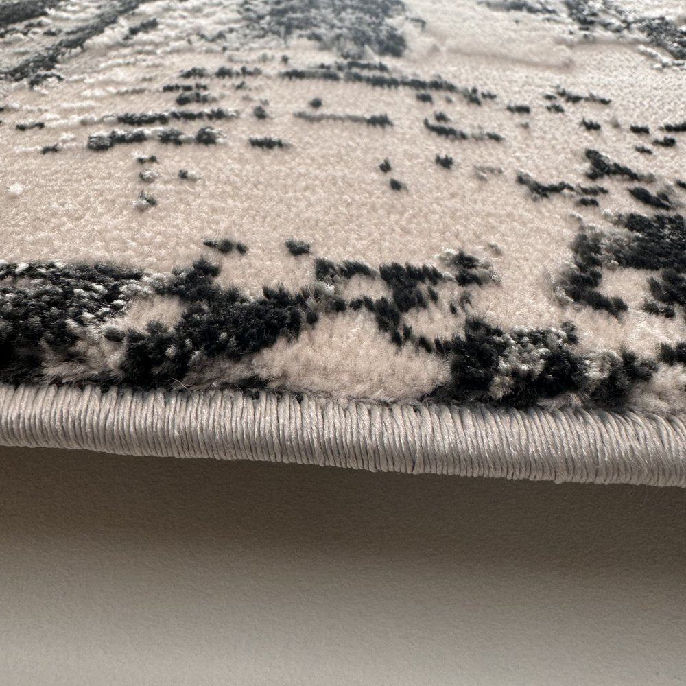 7' X 10' Black Gray and Beige Abstract Area Rug